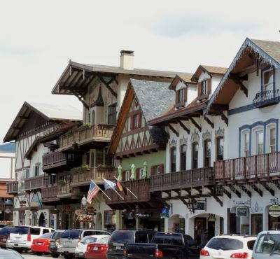 Leavenworth - a street scene with cars parked on the side of the road