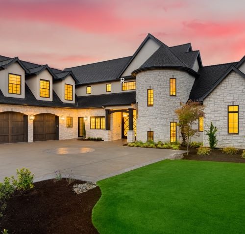 a large house with a large driveway and a driveway