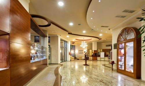 a lobby area with a large glass display case
