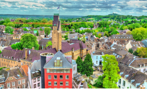 a maastricht cityscape of a church with a clock tower
