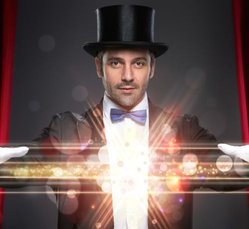 a magician with a magic wandet and a hat