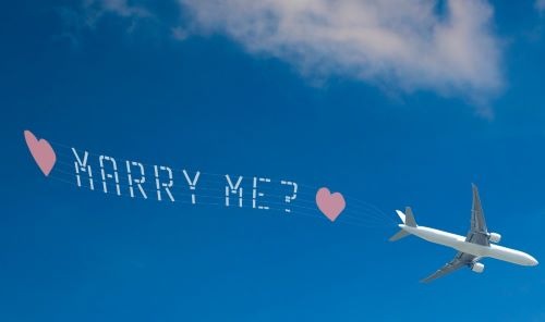 a plane with a message that says marry me