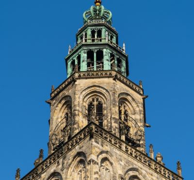 martinitoren - groningen - a clock tower with a clock on top of it