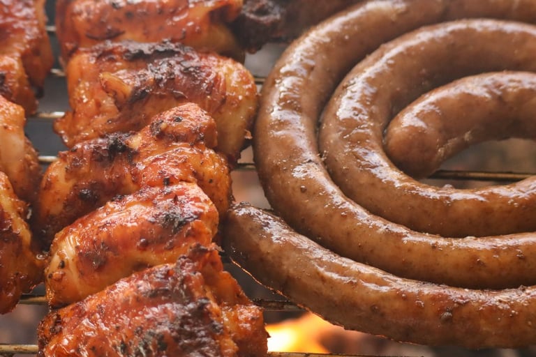 a grill with sausages and sausages on it