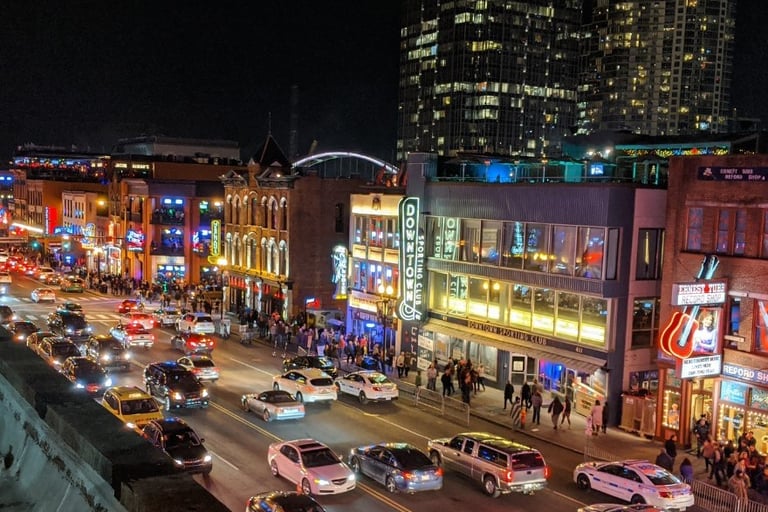 Nashville - a city street scene with cars parked on the side of the road