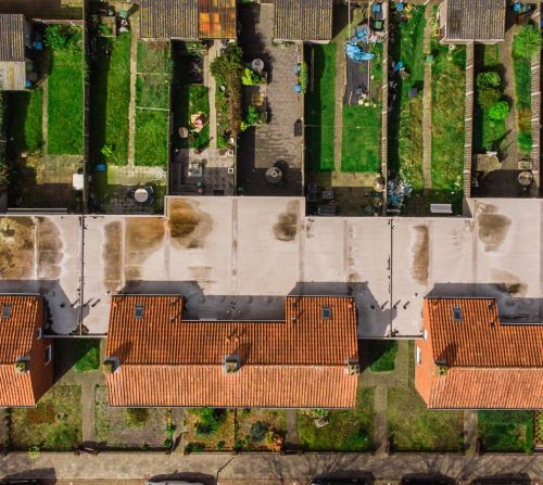 a row of houses with red tiled roofs and red tiled roofs