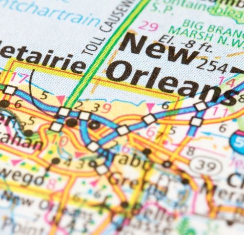 Close-up of a Louisiana road map showing New Orleans, Metairie, and surrounding regional highways.