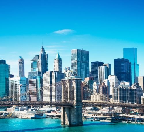 a bridge spanning the city of new york with a bridge in the background