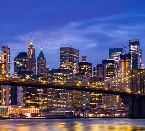 a bridge spanning the new york city's skyline