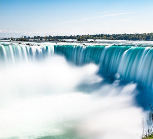 a waterfall in the middle of a large waterfall