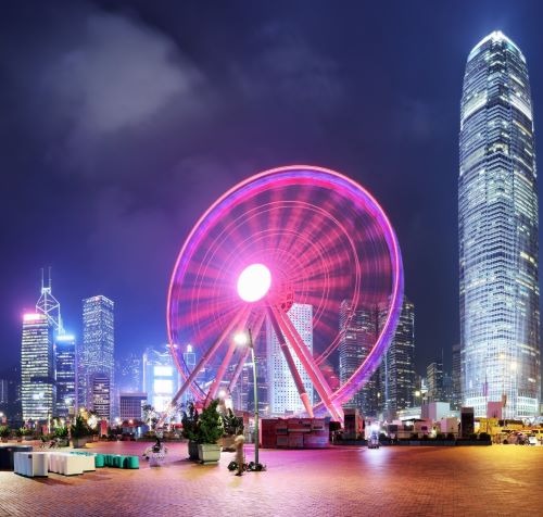 a ferris wheel in the city at night