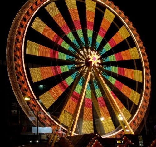 a ferris wheel with a ferris wheel in the middle of a ferris wheel