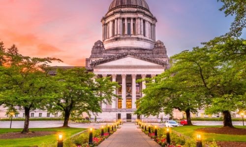 a building with a clock tower and a walkway