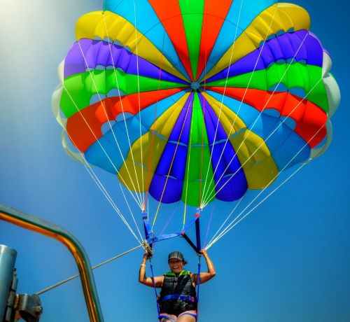 a person parasailing on a parachute