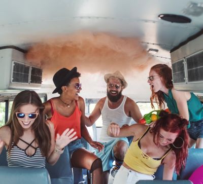 party - a group of people sitting on a bus