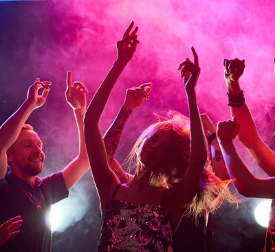 a group of people dancing at a party
