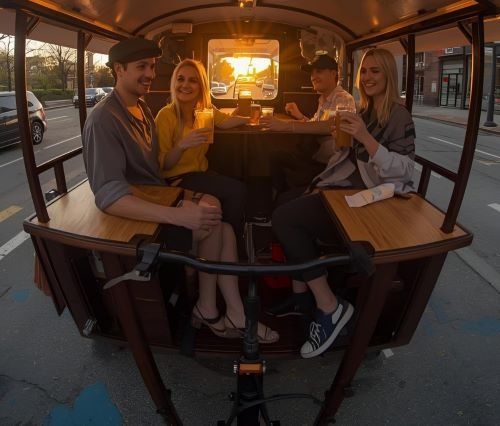 people enjoying a pedal pub tour in Detroit