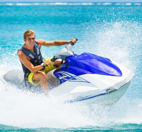 a man riding a jet ski in the ocean