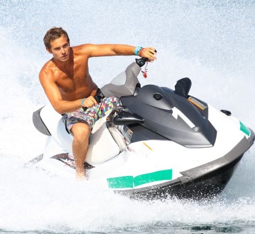 a man riding a jet ski in the water