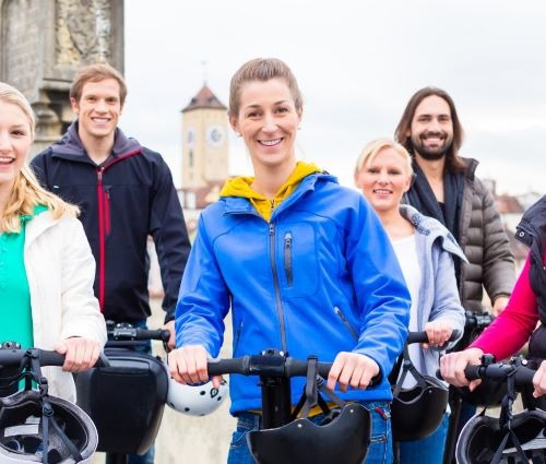 a group of people enjoying segways