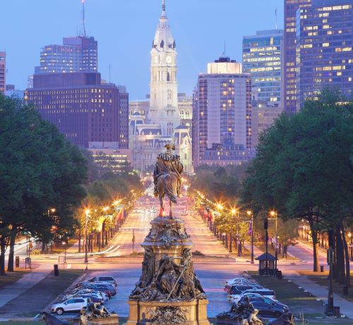 a statue of a statue of a man on a city street in philadelphia