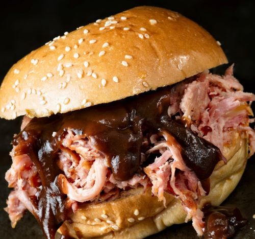 a sandwich sandwich with meat and cheese on a bunt