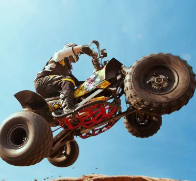 a person riding a dirt bike on a dirt track