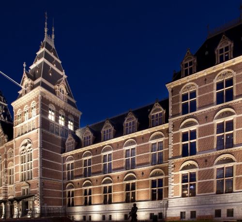 rijksmuseum - a large building with a clock tower in the middle of it