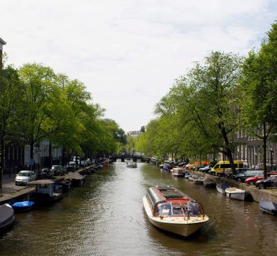 tour boat - a boat on a river with a boat in the water