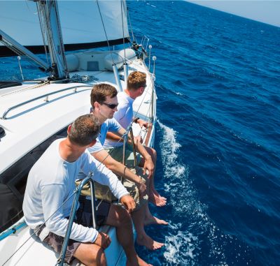 a group of people sitting on a boat