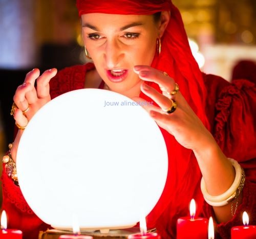 a woman in a red dress holding a crystal ball