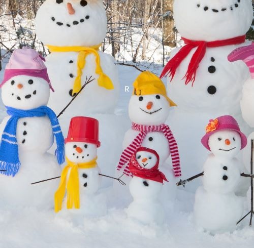 a group of snowmen in a pile of snow