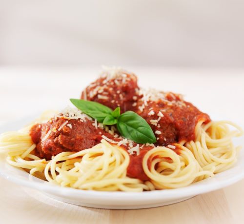 a plate of spaghetti sauce with spaghetti sauce and meatballs