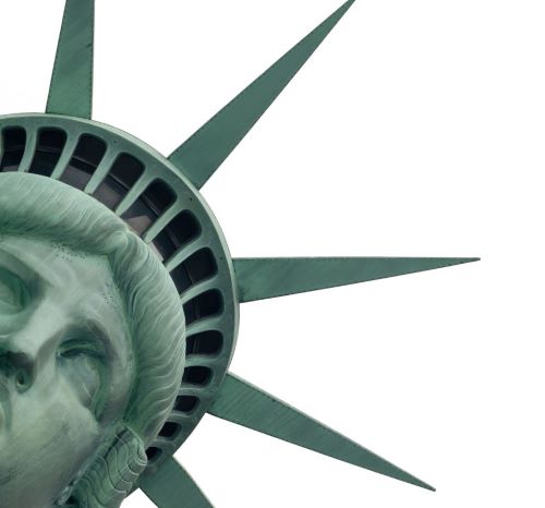 a statue of liberty in front of a white sky