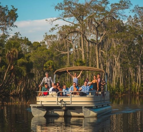 a group of people on a boat in the water