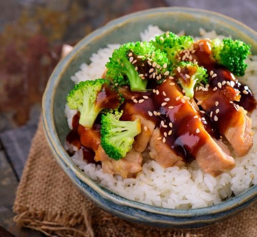 a bowl of rice with broccoli and teriyaki