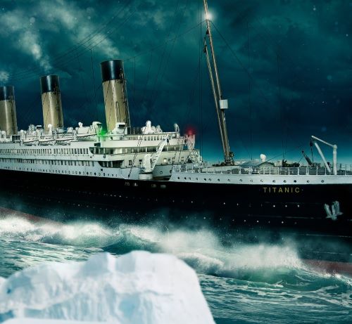 titanic - a large ship in the ocean with a large iceberg