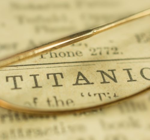 newspaper with the word “Titanic” on it