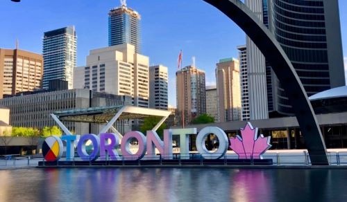 a large sign that says toronto on the front of a building