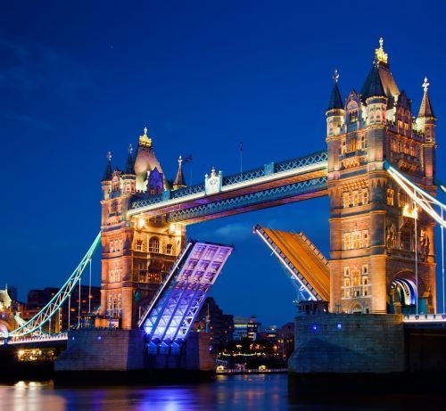 a bridge spanning the river with a bridge in the background