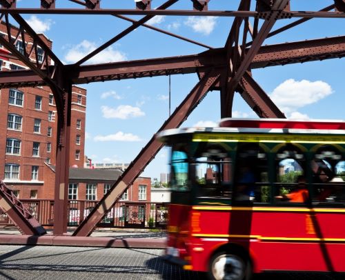 a bus driving over a bridge over a bridge