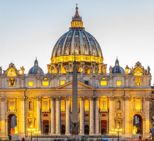 a large building with a dome shaped building in the background