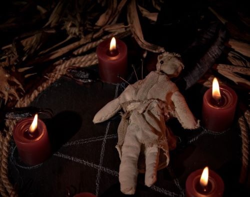 a voodoo doll doll sitting on a table
