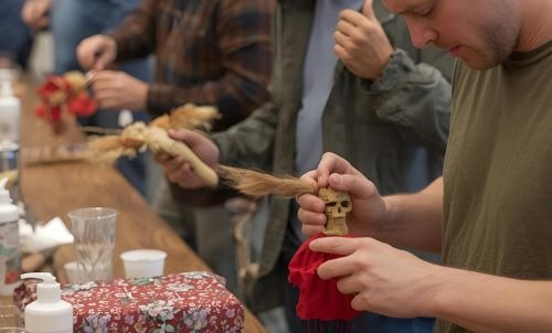 people making a voodoo doll