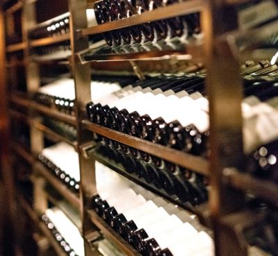 a wine rack with bottles of wine and bottles of wine