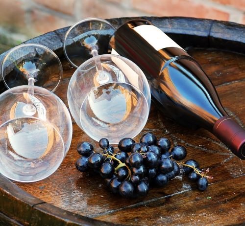 a wine glass and wine glasses on a barrel barrel
