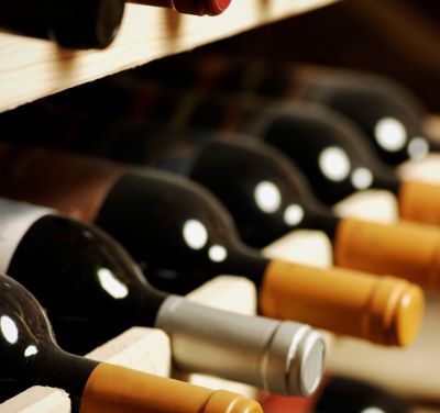 a wine rack with bottles of wine and bottles of wine