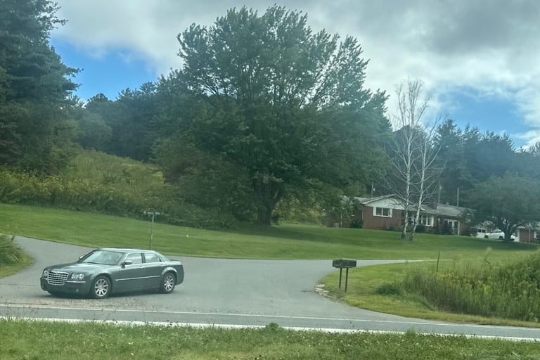 A grey Chrysler 300 merging on highway representing locksmith service for lockouts, spare keys, & igntion repair