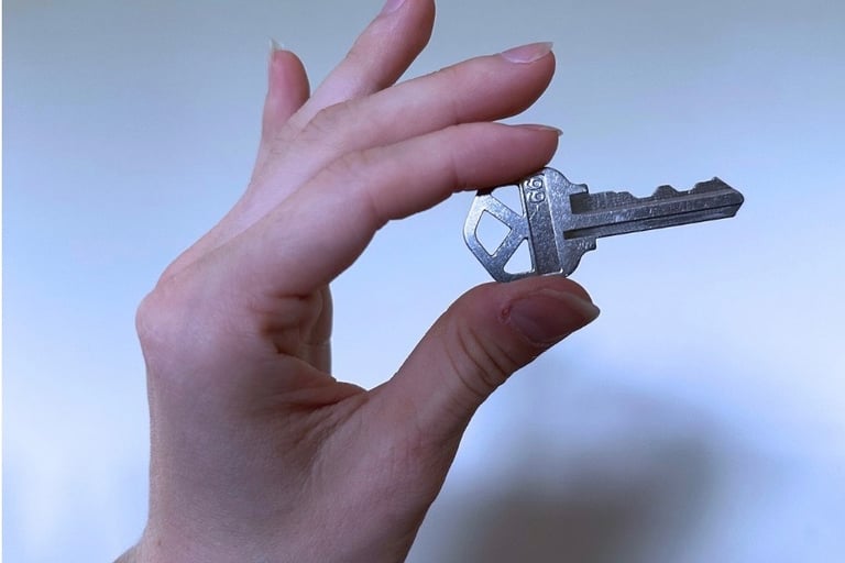 Hand holding a key for duplication service in Asheville