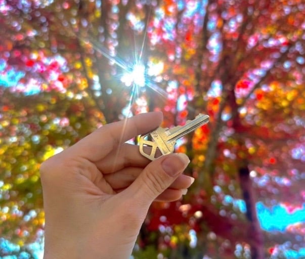 Metal car key duplication with fall tree in background in Canton, NC